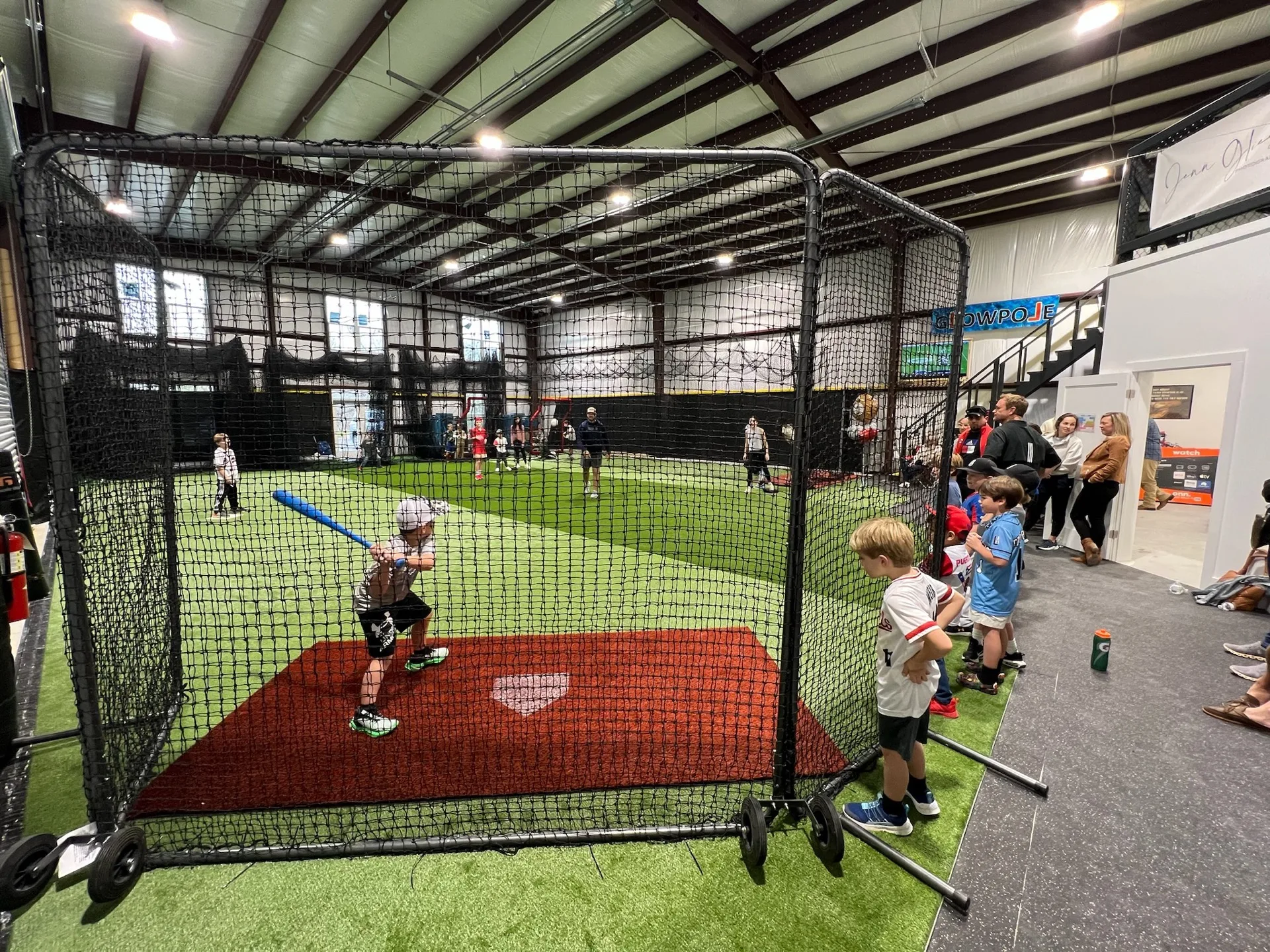Wide view of the indoor batting cages at Taylor'd Athletics