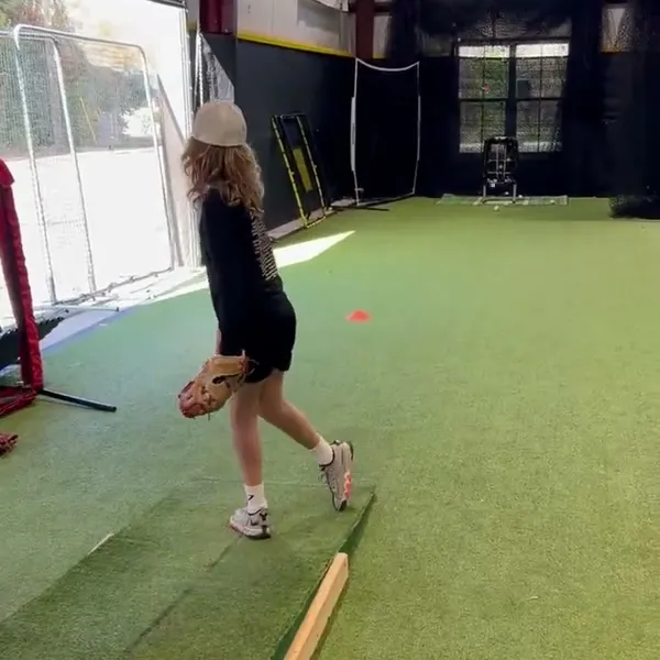 Female athlete working on pitching form