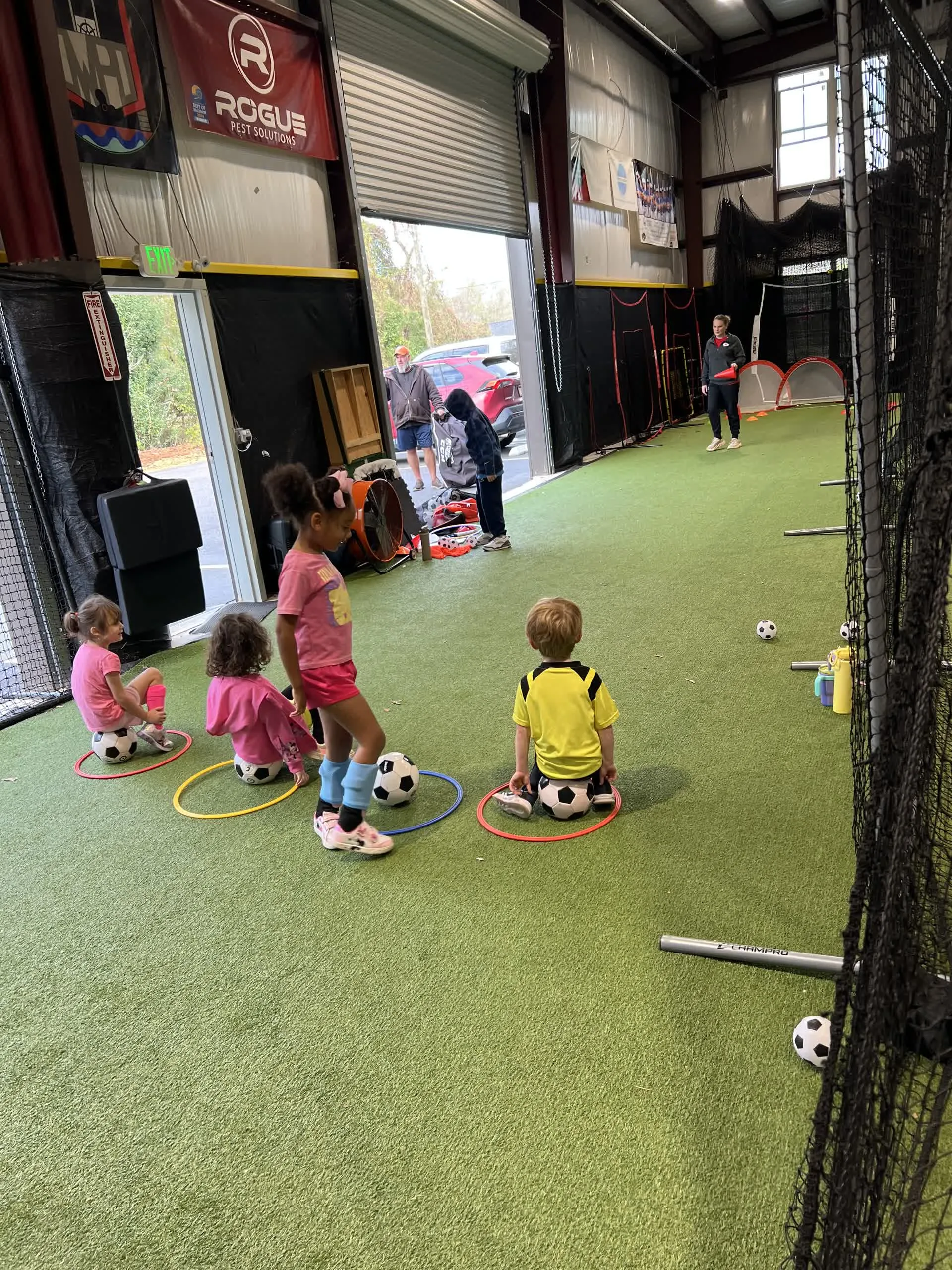 Young soccer camper doing agility drill